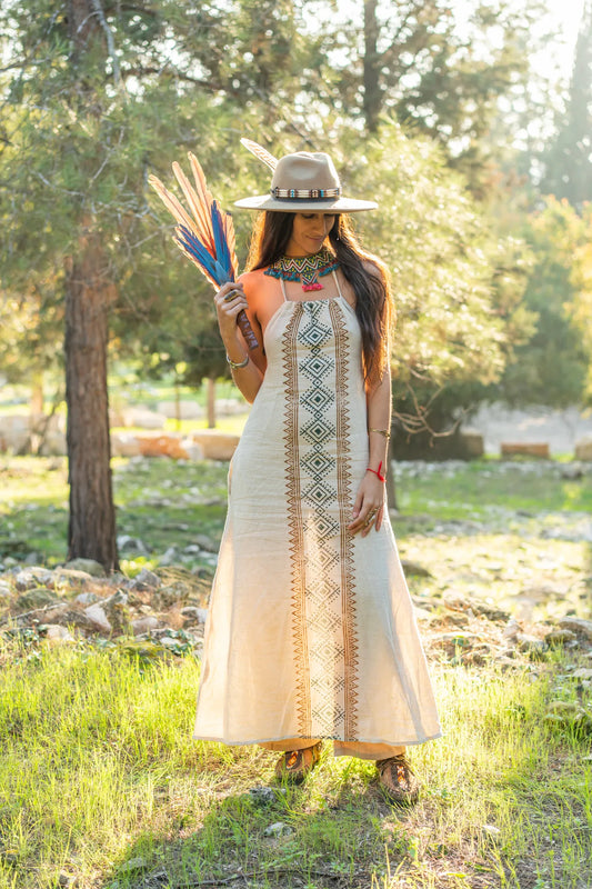 handcrafted cotton dress with ethnic block prints, highlighting the natural fabric and detailed tribal patterns under soft golden sunlight