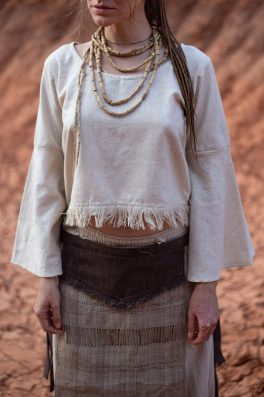 women wearing handwoven raw silk Veda top with bell sleeves and frayed hem.