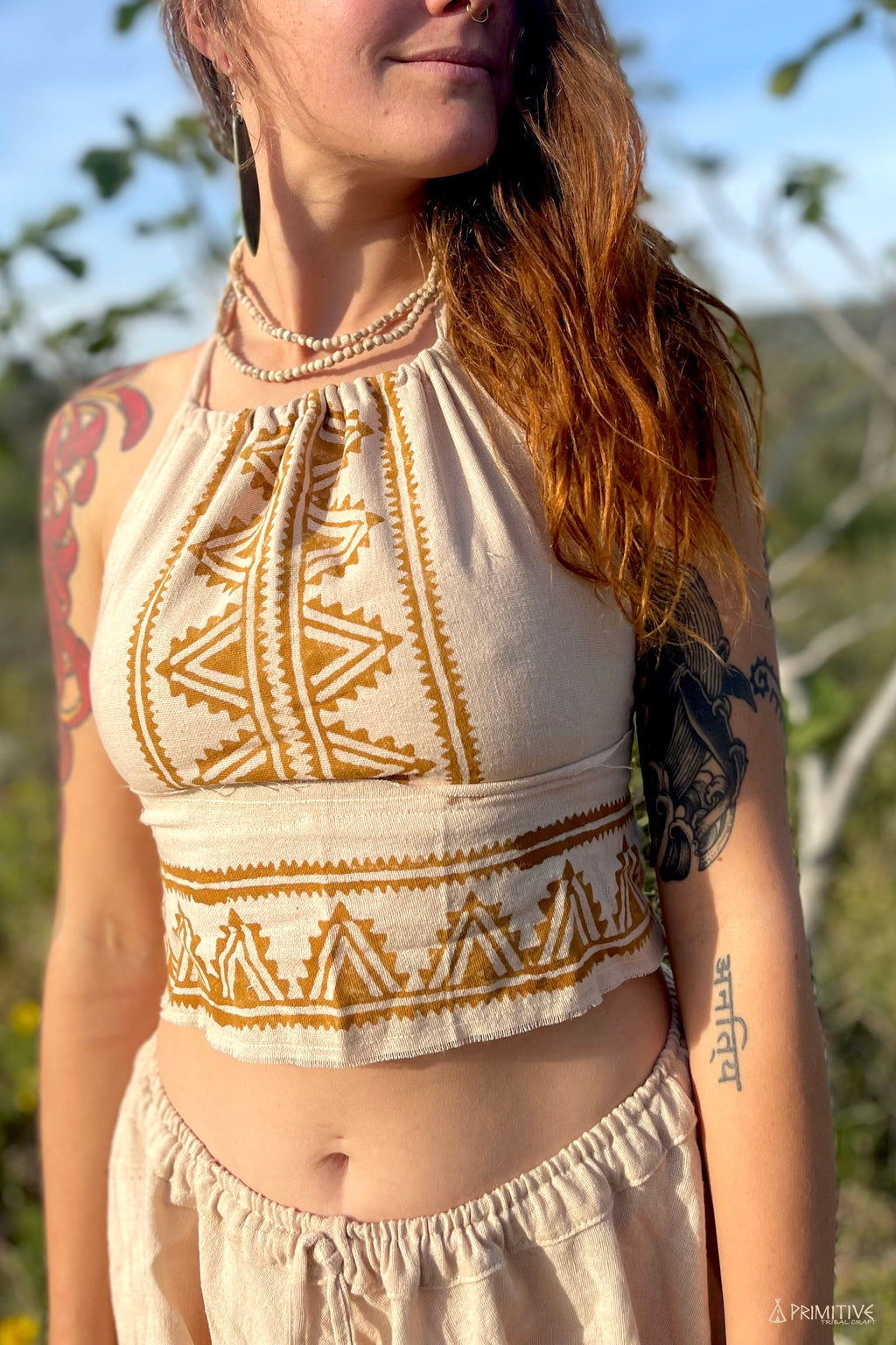 Woman wearing natural fabric crop top with camel blockprint geometric design from Ancient Butterfly Outfit Skirt Top Camel Blockprint collection outdoors