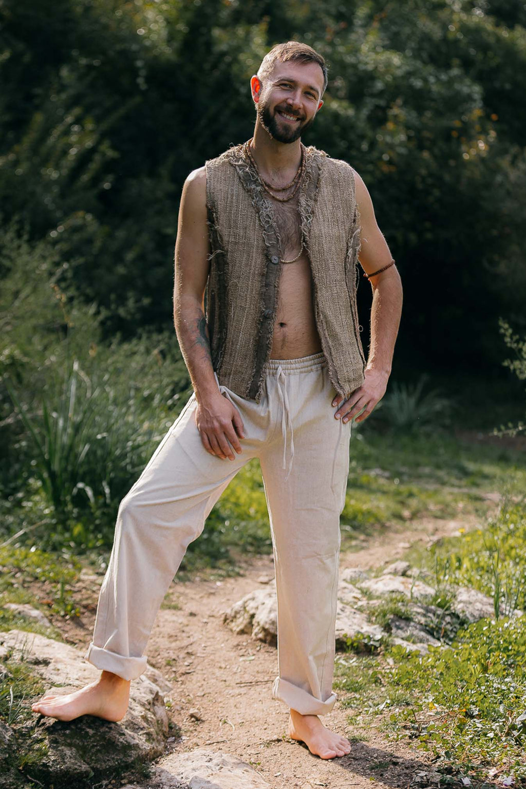 Himalayan nettle vest with frayed edges, natural layering piece worn outdoors.