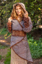 Woman wearing a Khadi jacket with extra-long solid color slouchy cuffs and textured woven fabric.