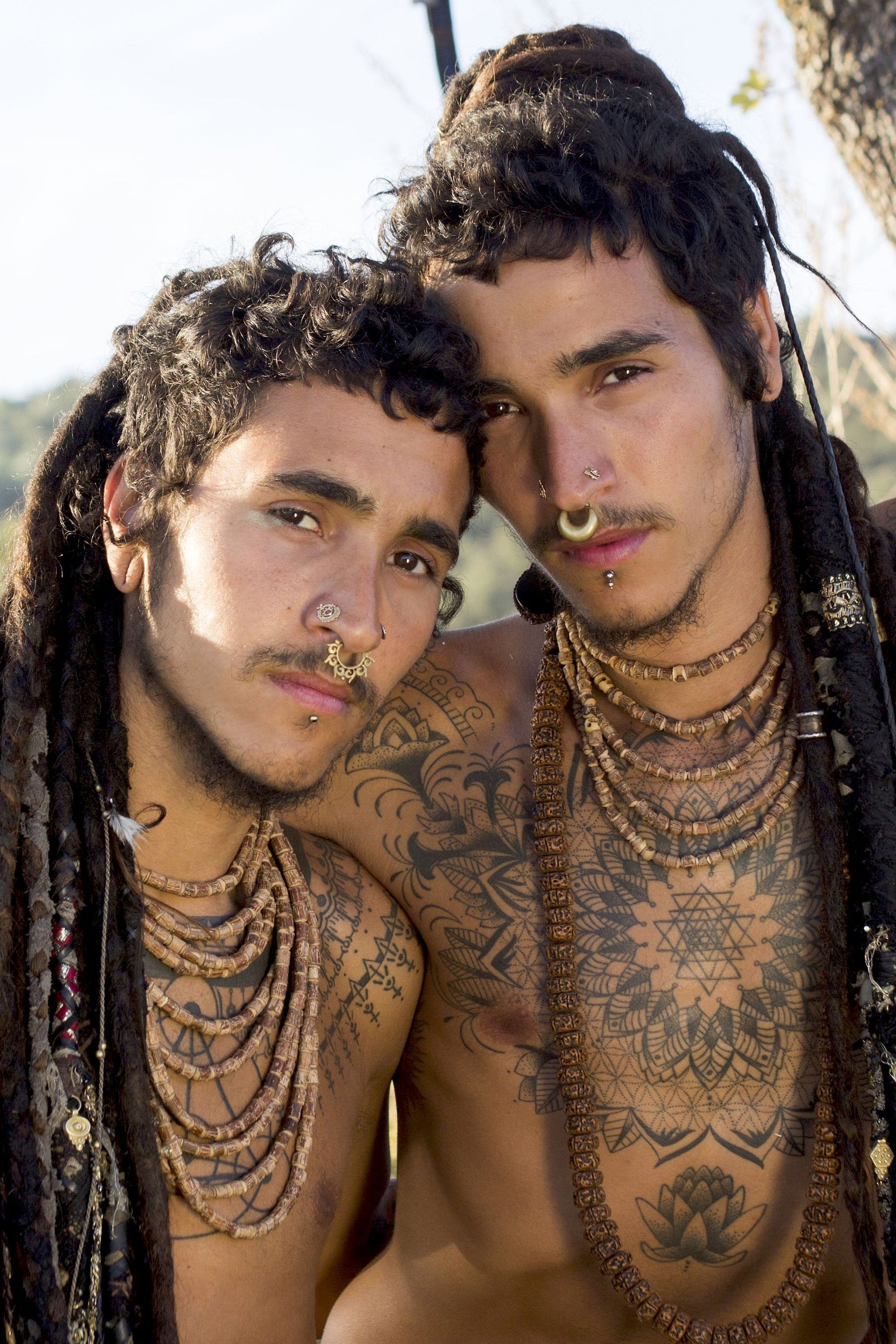 Two men wearing the large Tulsi wood beads necklace in a layered style, showcasing how the multiple strands drape naturally against the chest