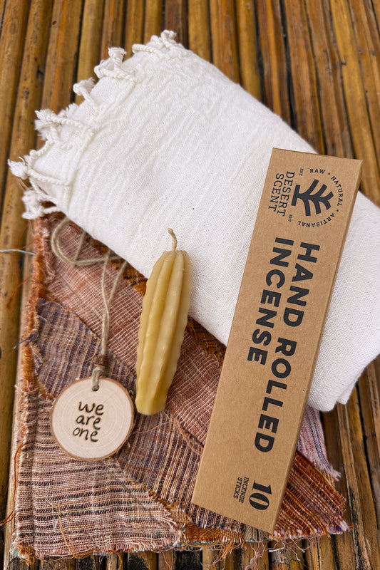 Simple Valentine gift set with handwoven white cotton scarf, hand-rolled incense, natural wax candle, khadi pouch and “we are one” wooden pendant