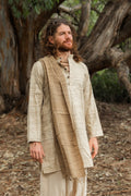  Man wearing a natural wild silk long kurta, close-up portrait in a forest setting