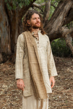 Man wearing a natural wild silk long kurta, close-up portrait in a forest setting