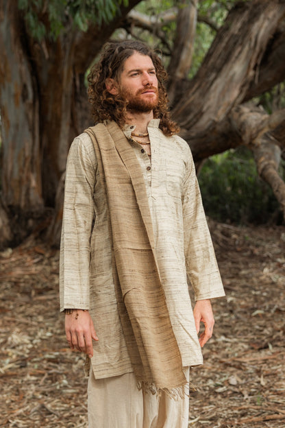  Man wearing a natural wild silk long kurta, close-up portrait in a forest setting