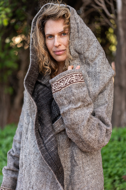 Close up of the grey wool Coat with hood and embroidery details