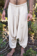 Close-up of handwoven raw silk harem pants , showing elastic waistband, roomy drape and relaxed boho fit.