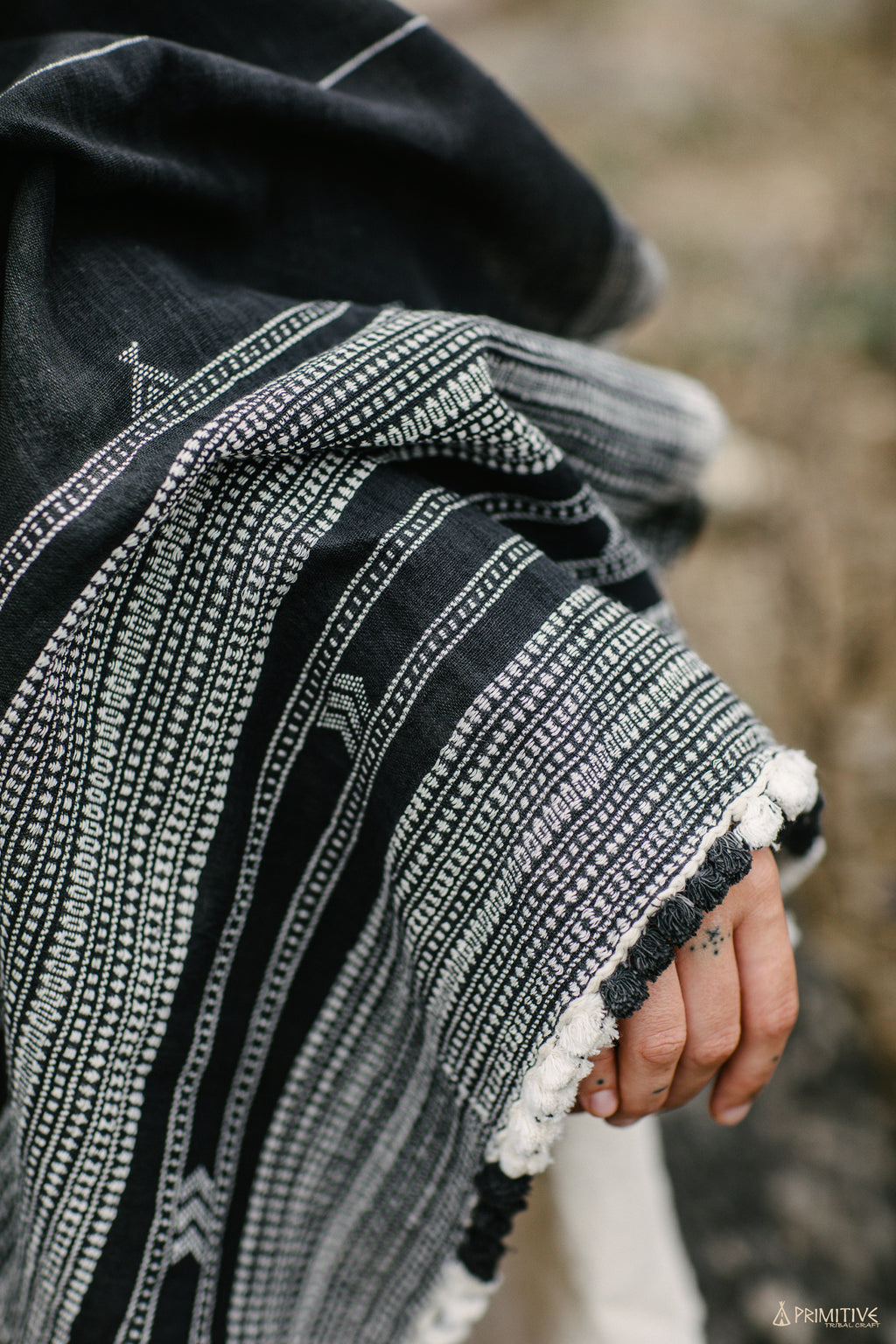 Handloom handwoven black organic cotton shawl with white tribal pattern and fringe detail