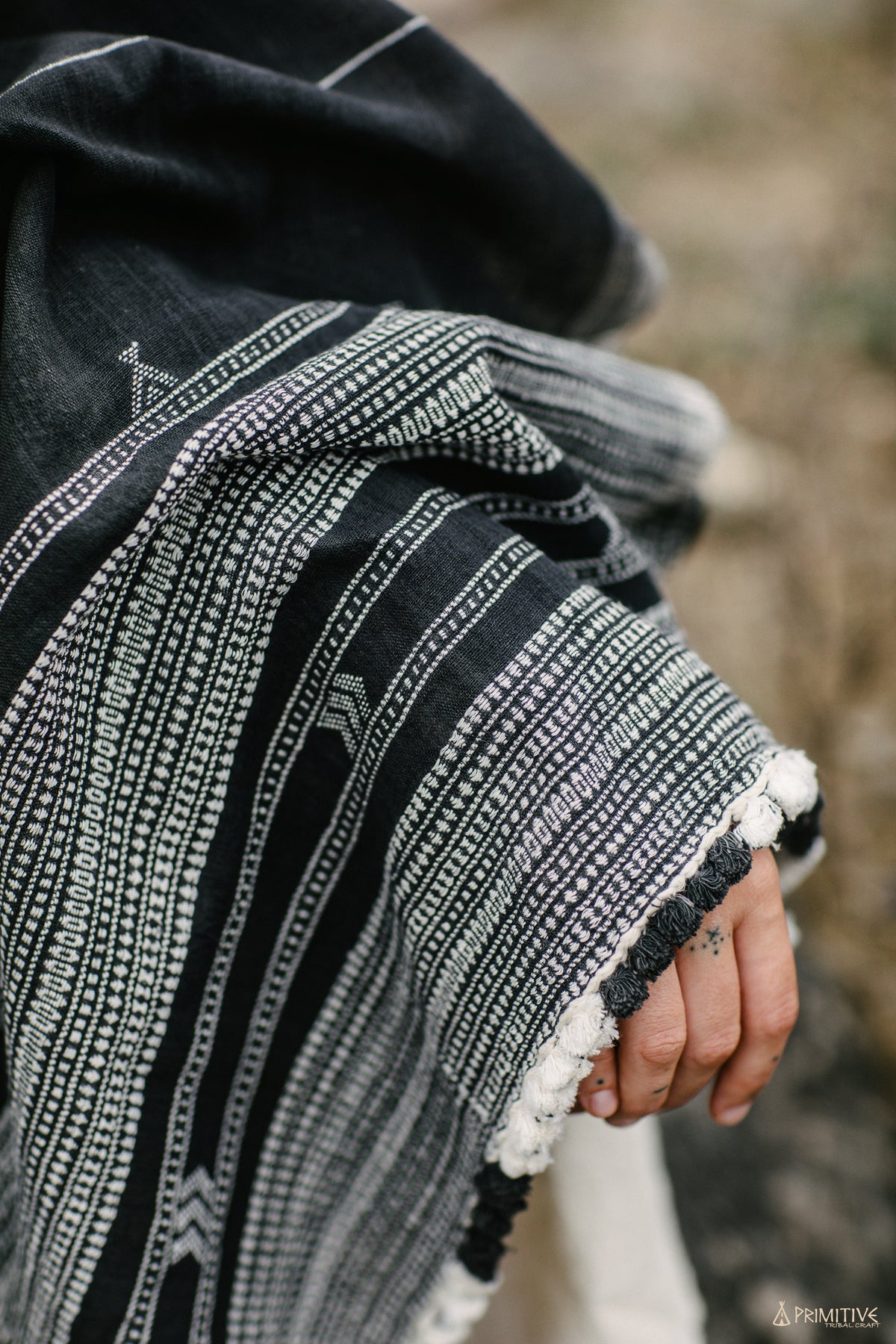 Handloom handwoven black organic cotton shawl with white tribal pattern and fringe detail