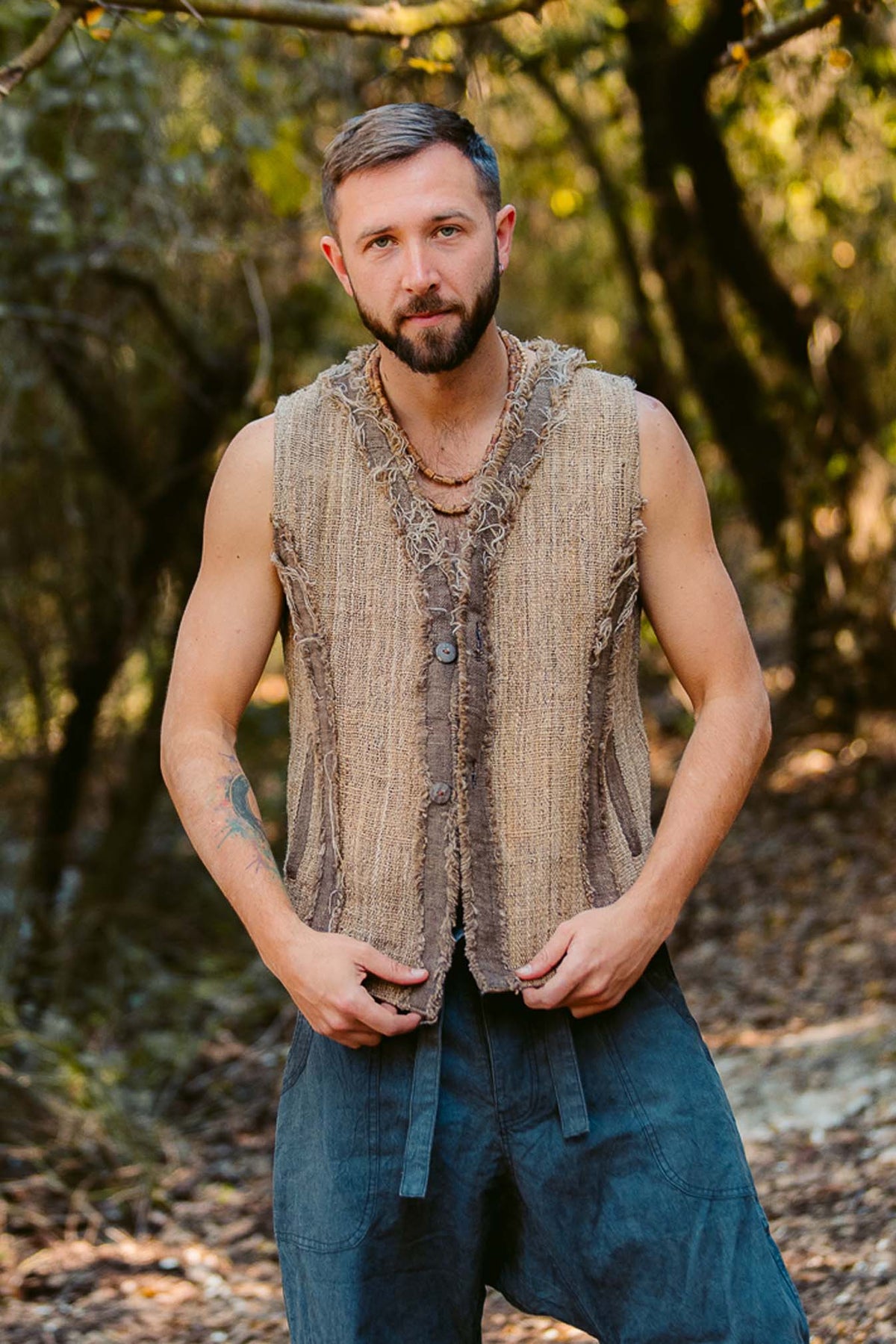 Man wearing handwoven Himalayan nettle yarn vest made from wild nettle fiber.