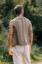 Back view of handwoven Himalayan nettle vest with raw texture and frayed edges.