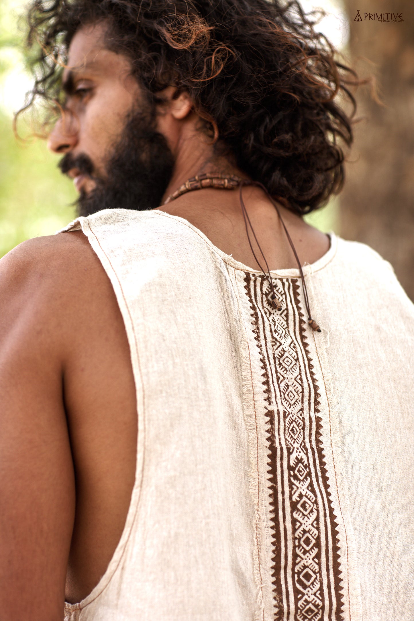 Close-up of the back of the handwoven raw silk tank top highlighting the center tribal block print and the raw, textured fabric.