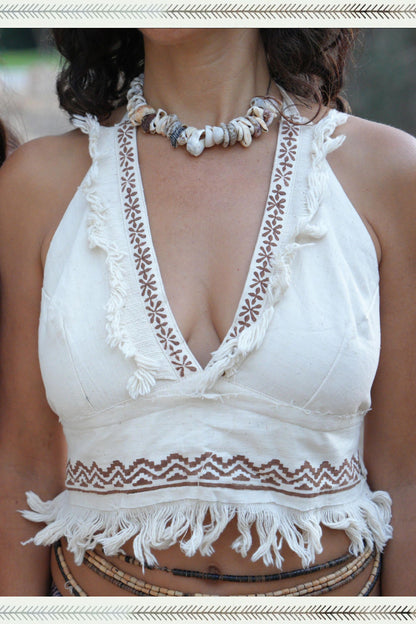 Close-up of a handwoven khadi cotton halter top with deep V-neck, tribal block print trim