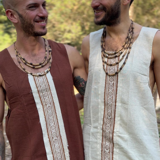 two men wear raw silk sleeveless shirts in brown and in natural color 