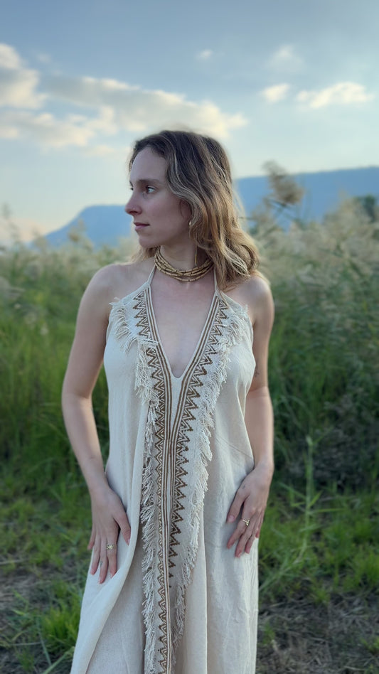 Video showing the fit and flow of the Maya Dress, a lightweight short cotton butterfly dress with patterned front trim.