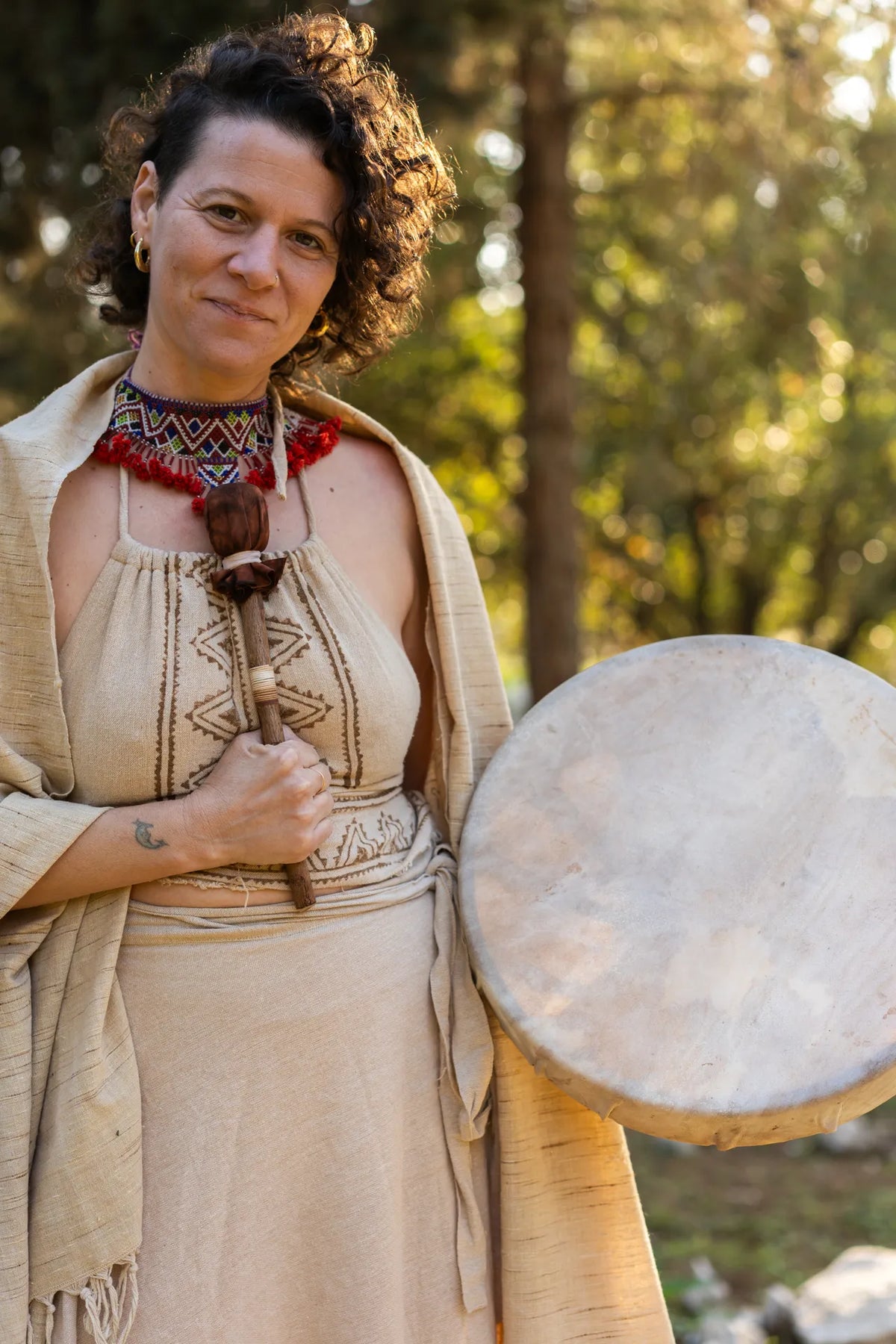 Natural boho outfit set with wrap skirt, halter top and shawl photographed in warm sunlight,יhippie festival and ceremony vibe