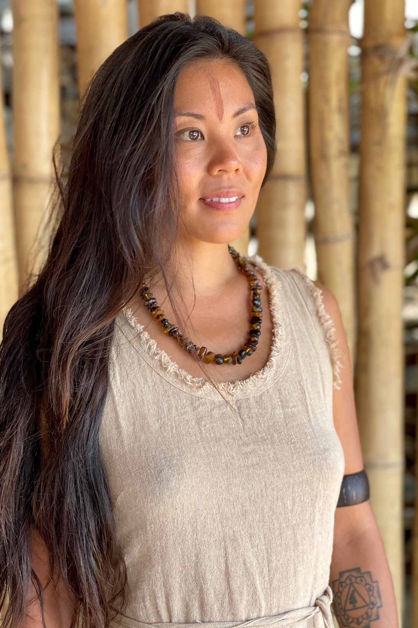 earthy Woman wearing Dark Amber Necklace