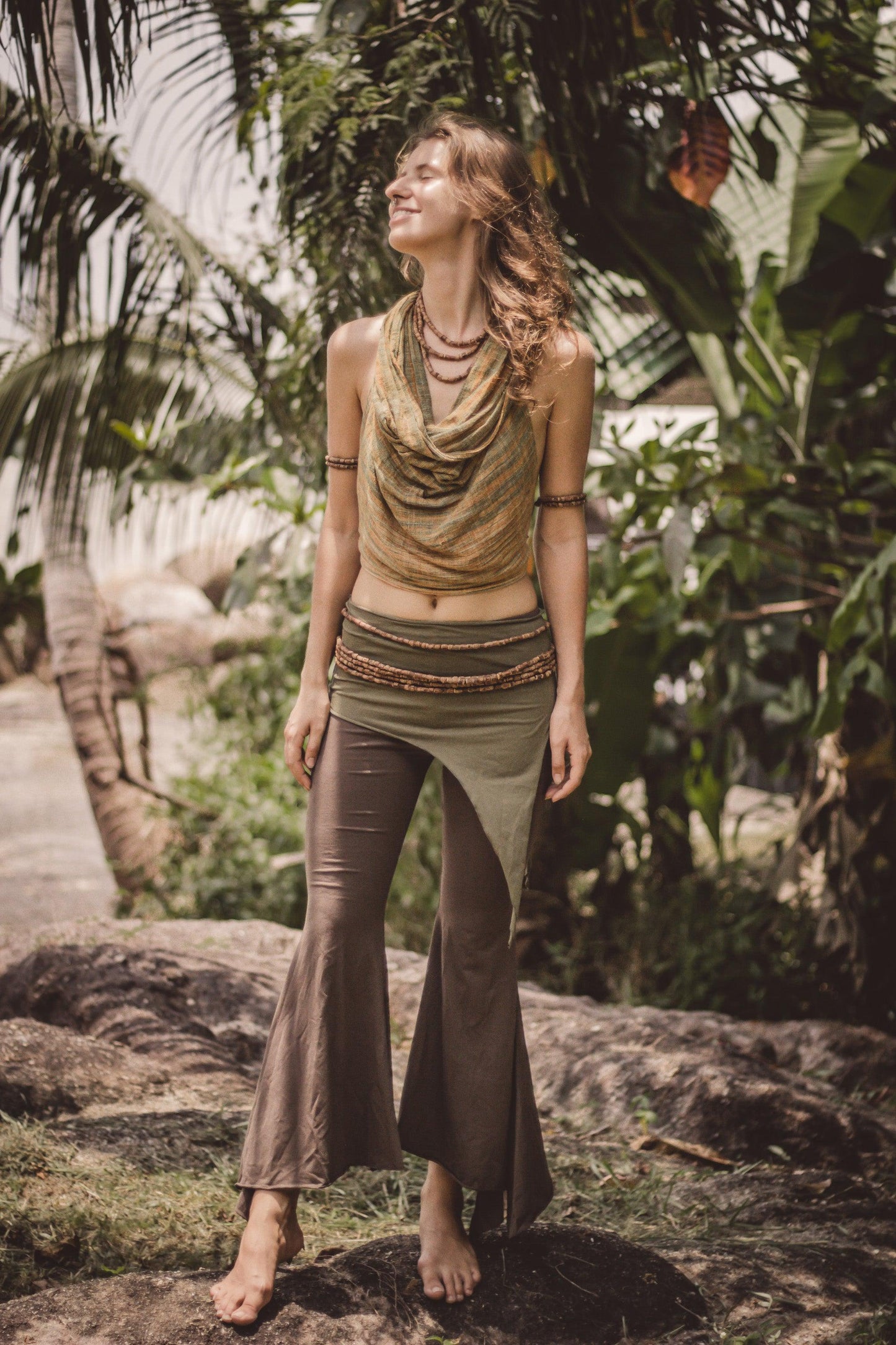 Model wearing brown organic cotton wide flare yoga leggings, front view