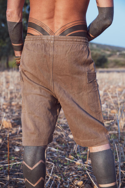 back shot of a man wearing natural dyed hemp shorts