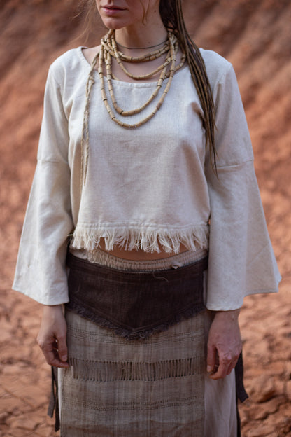 women wearing handwoven raw silk Veda top with bell sleeves and frayed hem.